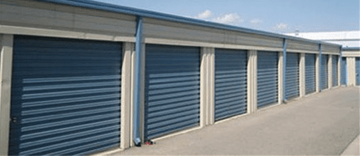 A row of blue and white garage doors.